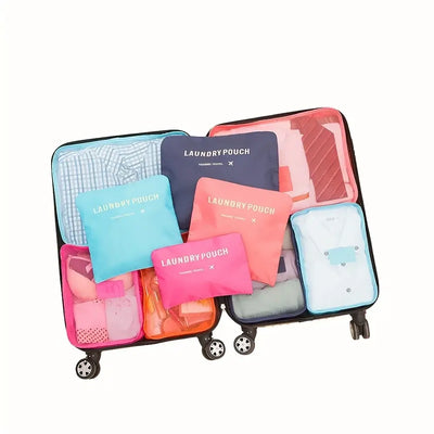 Packing cubes organized in a suitcase, featuring laundry pouches, for efficient travel storage.