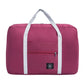 Nevytech Women’s Travel Handbag Waterproof in blue and pink colors displayed on a wooden chair.