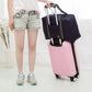 Nevytech Women’s Travel Handbag Waterproof in blue and pink colors displayed on a wooden chair.