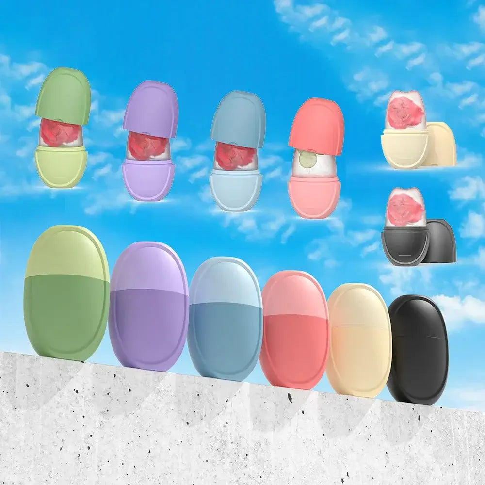 Colorful ice rollers for face and eye care in various shades against a clear blue sky, perfect for skincare routines.