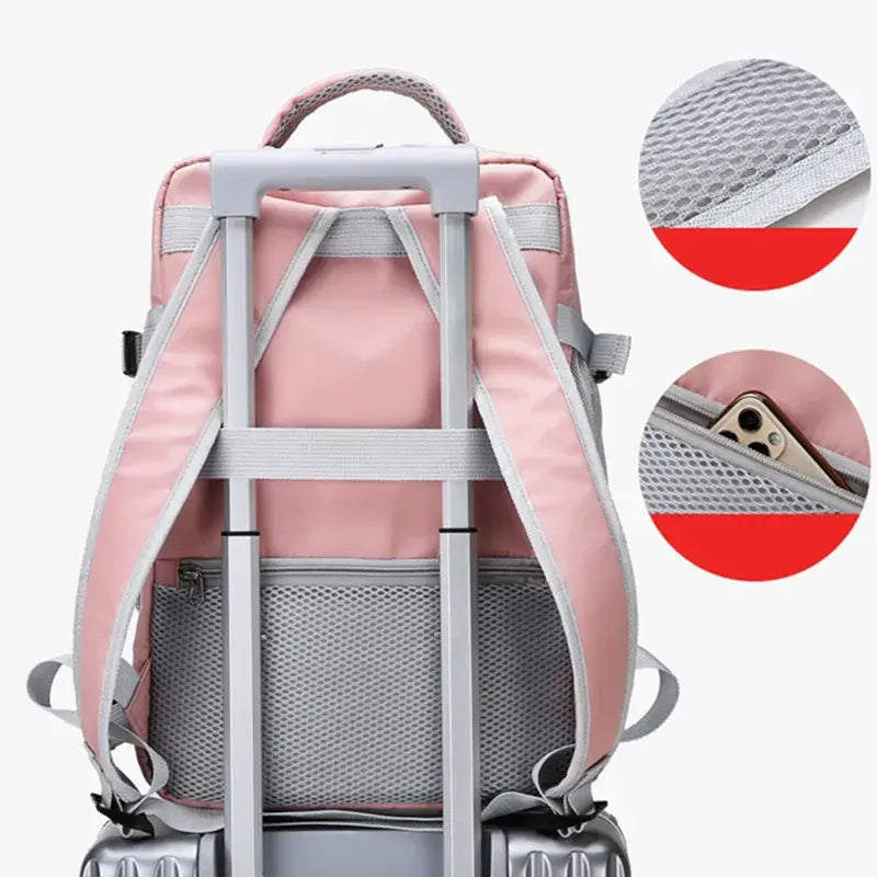 Back view of a pink travel backpack for women with anti-theft features, mesh pockets, and luggage strap.