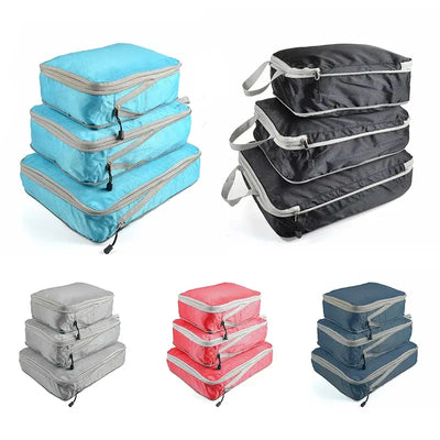 Set of foldable, compressible packing cubes in various colors for travel organization and storage.