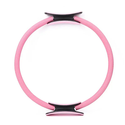 Pink yoga Pilates circle home gym equipment, ideal for fitness and inner thigh exercises.