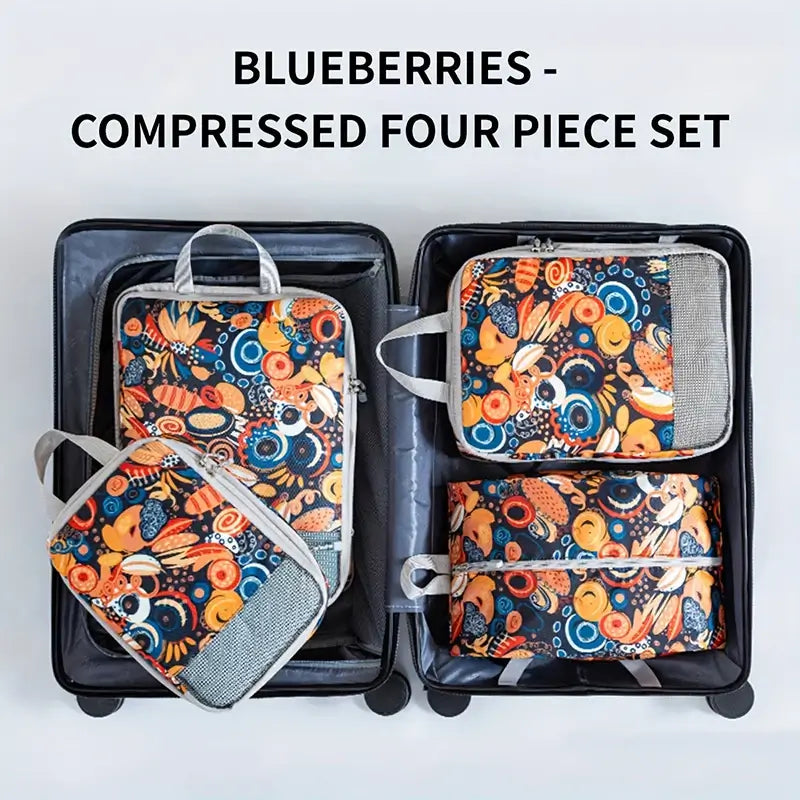 Four-piece compressed storage bag set featuring colorful blueberry design in a suitcase.