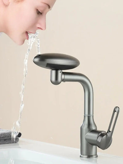 Multi-functional waterfall basin faucet with 360° rotation and hot/cold water options, demonstrated in use.
