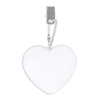 Heart-shaped LED light purse charm with clip, perfect for women, automatic motion-activated, fashion accessory.