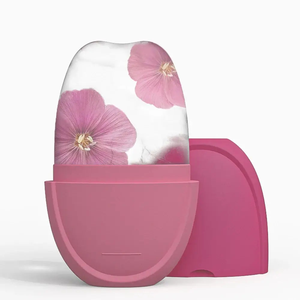 Ice roller with pink flowers for facial beauty and spa skincare, perfect for reducing puffiness and tightening pores.