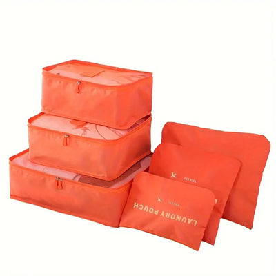 Set of 6 orange travel packing cubes and pouches for organized luggage storage and travel accessories.