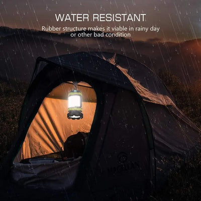 Water resistant LED camping lantern illuminating a tent in the rain, showcasing its durability in bad weather conditions.
