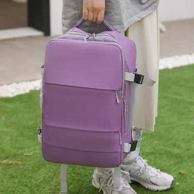 Stylish purple travel backpack for women, featuring a large capacity and anti-theft design, perfect for casual outings.