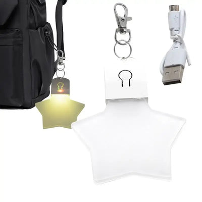 Purse heart LED light keychain with USB charger, designed for women and kids, adds charm and functionality to bags.