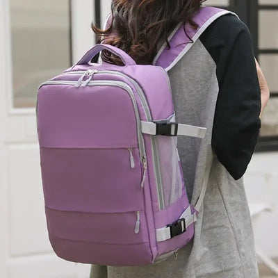 Large capacity waterproof purple travel backpack for women with anti-theft features and USB charging port.