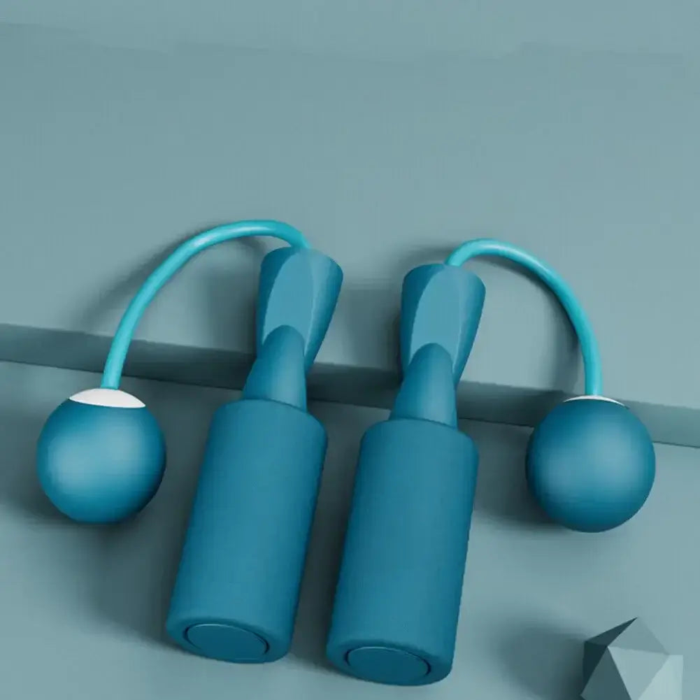Blue cordless skipping rope with heavy balls, ideal for fitness training and aerobics for men and women.