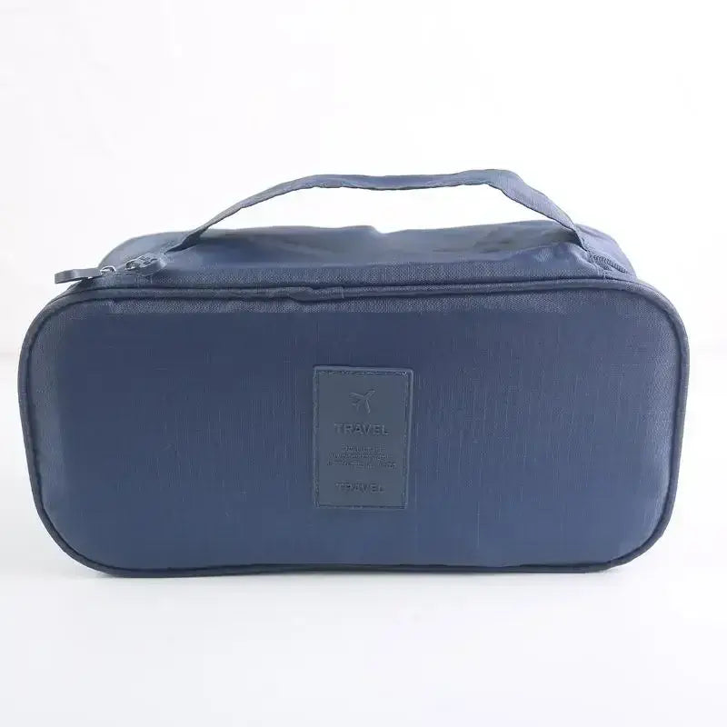Lightweight travel organizer bag in navy blue for efficient packing of underwear and bras.
