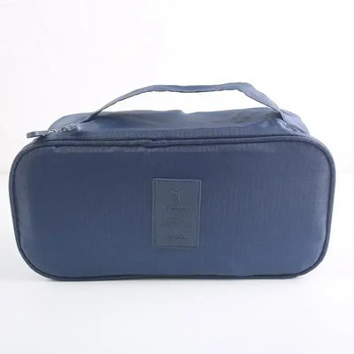 Lightweight travel organizer bag in navy blue for efficient packing of underwear and bras.