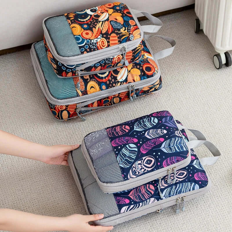 Colorful set of 4 foldable storage bags on a carpet, ideal for travel organization and laundry.