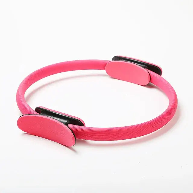 Pink Pilates ring for yoga and fitness training, essential tool for body shaping and muscle building exercises.