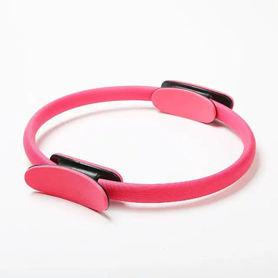 Pink Pilates ring for yoga and fitness training, essential tool for body shaping and muscle building exercises.