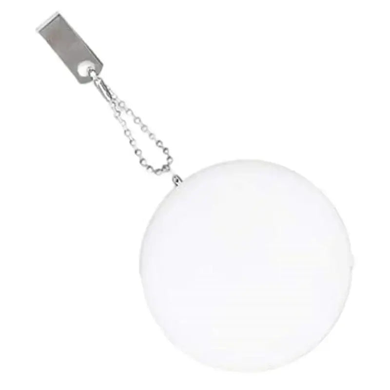 Heart-shaped LED light designed as a handbag charm, featuring motion activation and a stylish white finish.