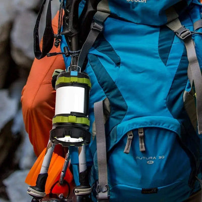 LED camping lantern attached to a blue backpack, ideal for outdoor activities like hiking and emergencies.