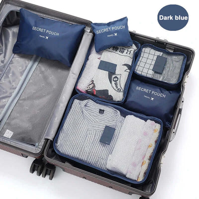 6-piece portable travel packing cubes set in dark blue, organized in suitcase with clothes, shoes, and secret pouch.