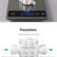 Nevytech Portable water purifier valve weighing 61g on digital scale with precautionary guidelines.