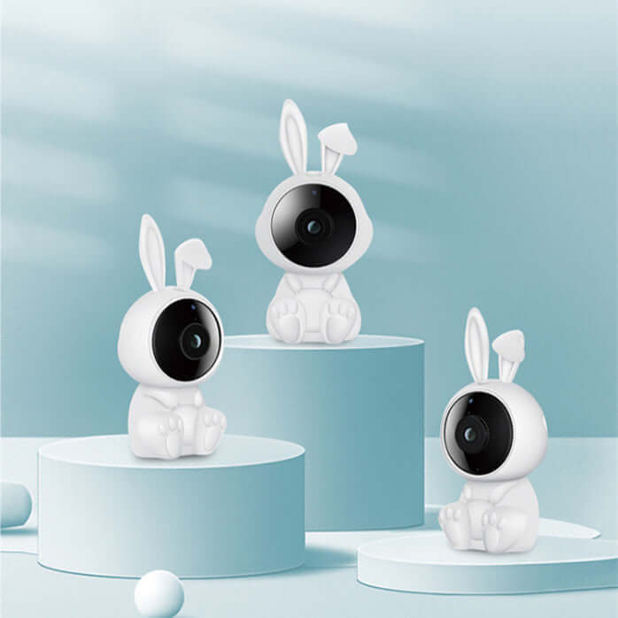 Three white rabbit-shaped Wifi intelligent baby monitors on pastel blue pedestals, perfect for nursery surveillance.