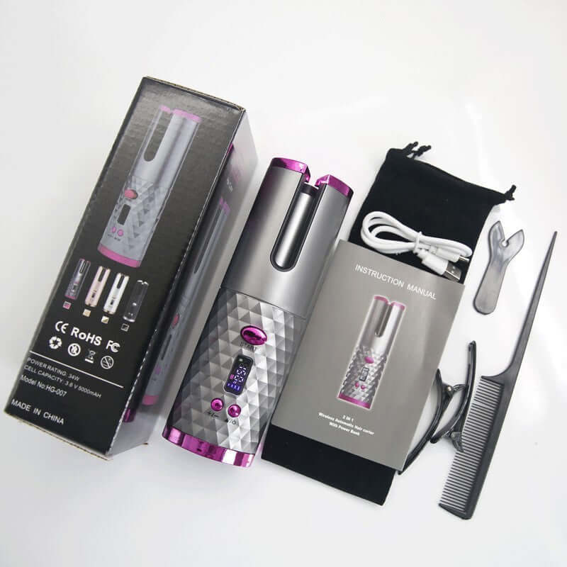 Wireless hair curler in pink and gray with accessories including manual, comb, and charging cable.