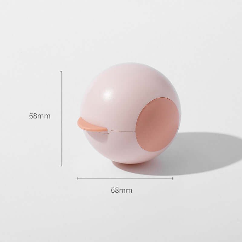 Spherical hair sticking device in soft pink color, measuring 68mm, perfect for travel and pet hair removal.