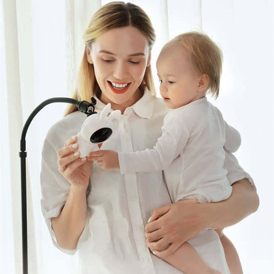 Mother and child interacting with Wifi Intelligent Baby Monitor, designed for secure and easy baby monitoring.